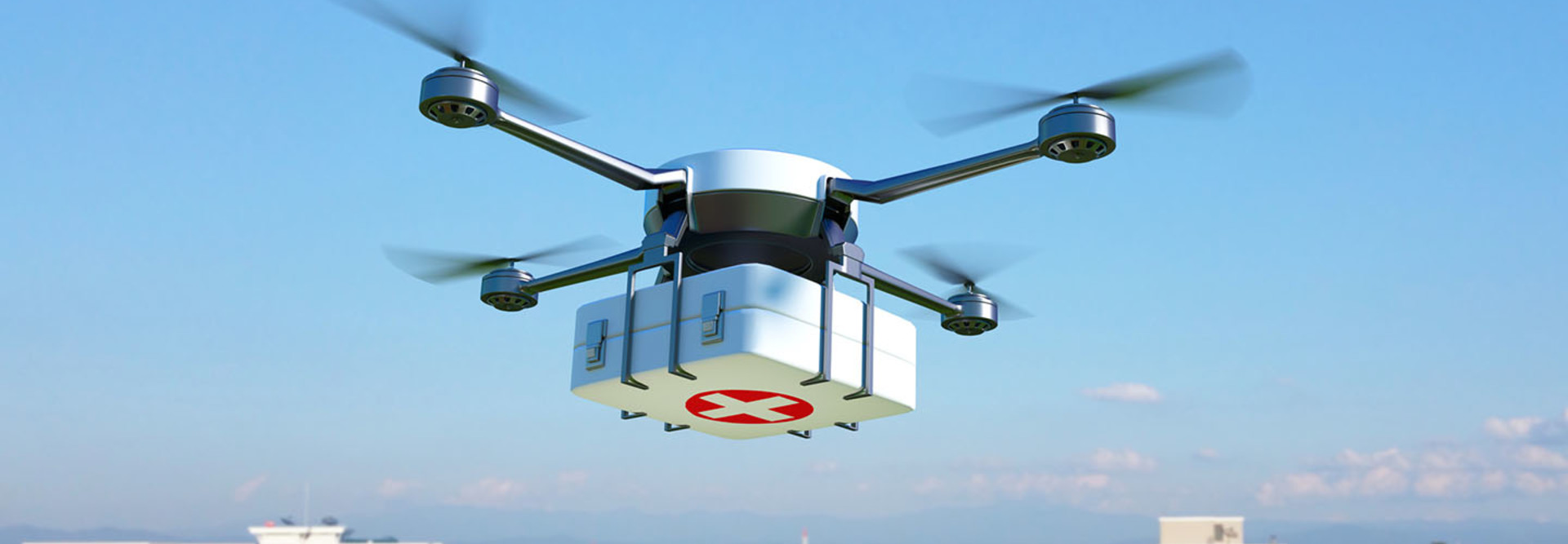 Drone with first aid kit flying over the town.