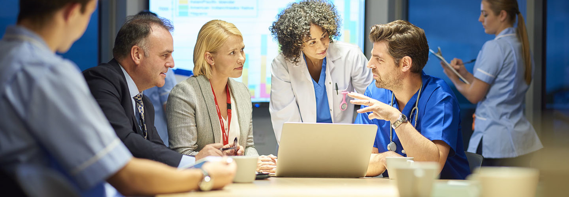 hospital management listening to doctor