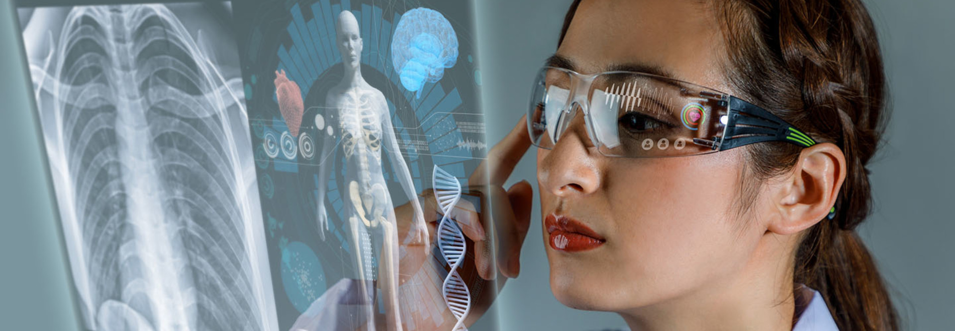 Young female doctor looking at hologram screen