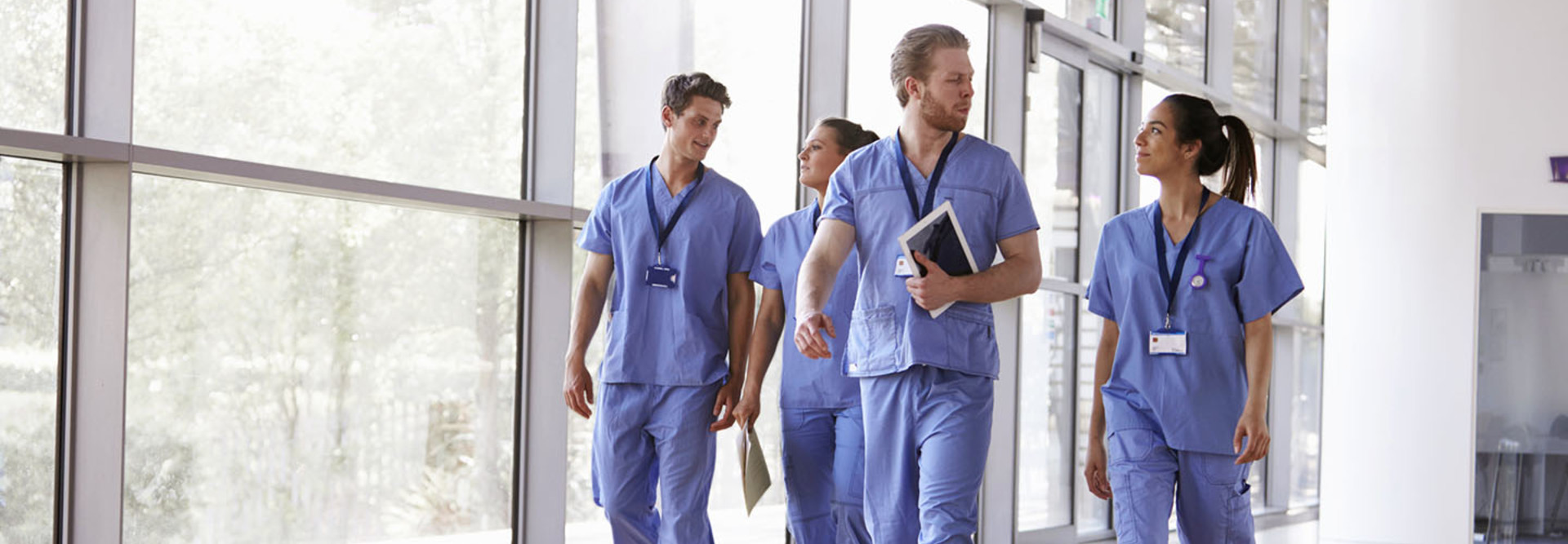doctors walking through hospital chatting
