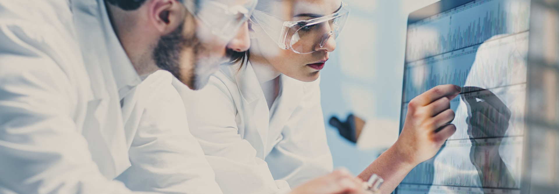 Researchers at a computer.