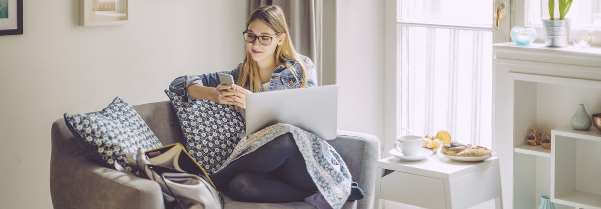 Young woman at home on computer