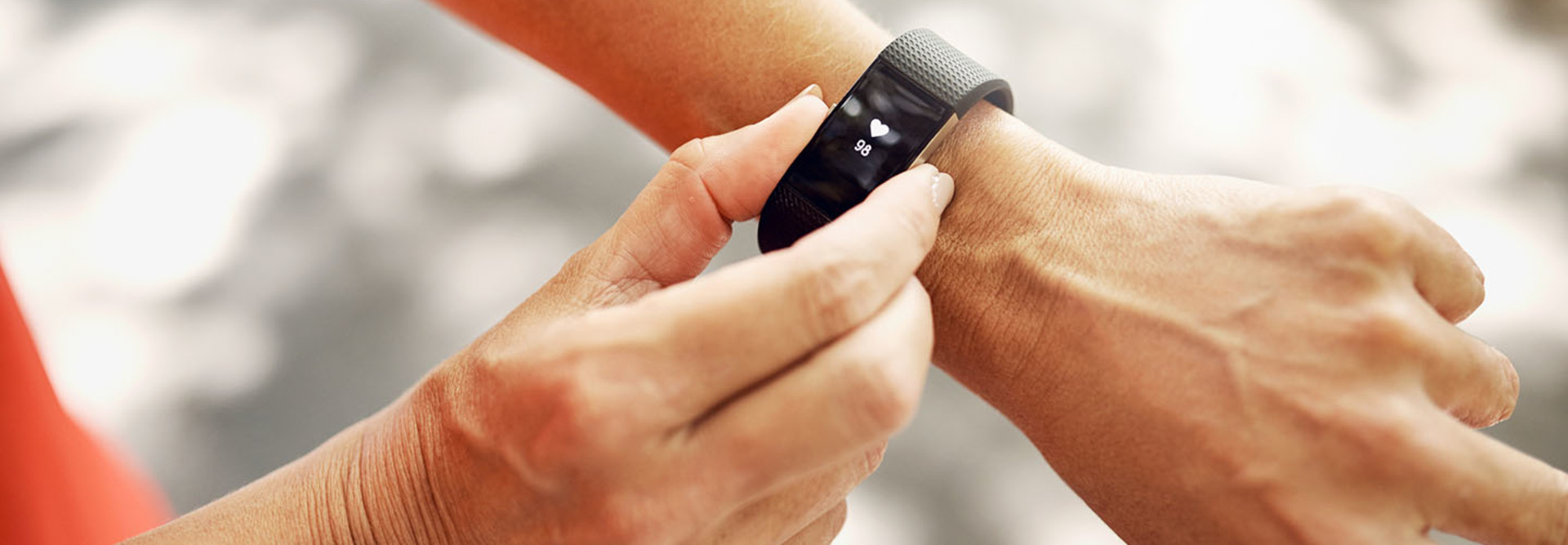 Shot of an unrecognizable woman checking her fitness tracker after a run