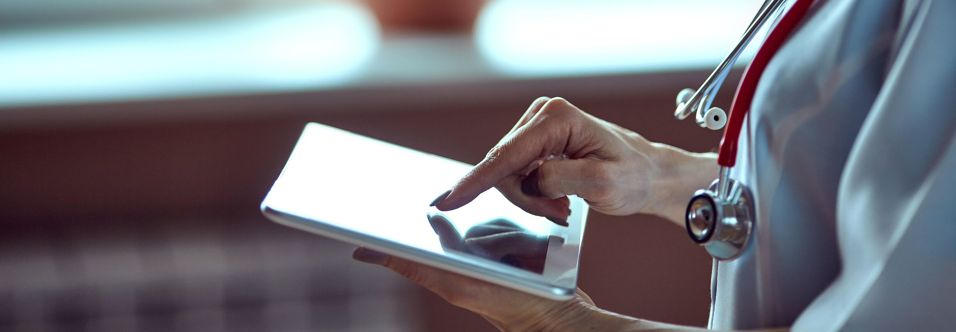 Doctor working on a digital tablet