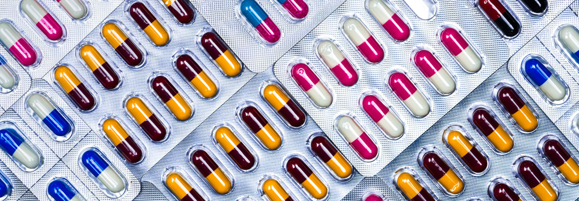 Full frame of colorful antimicrobial capsule pills.
