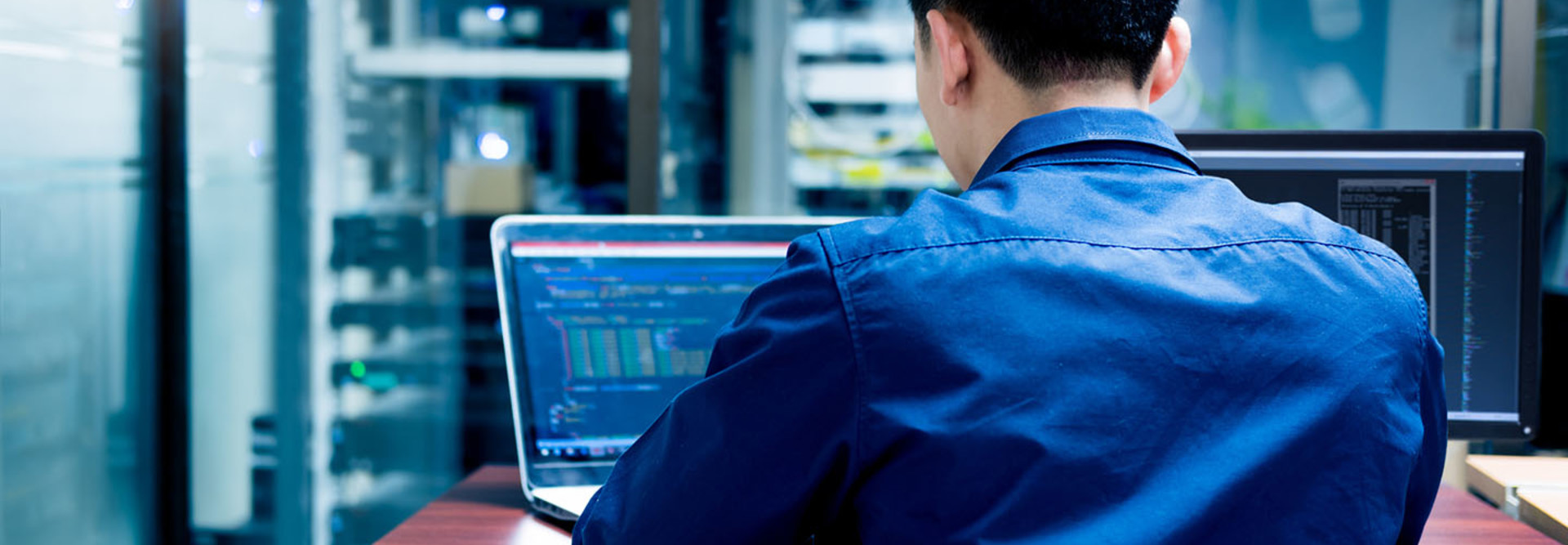 Young IT engineer working at server room is Multi Display, Data Protection Security Privacy Concept.