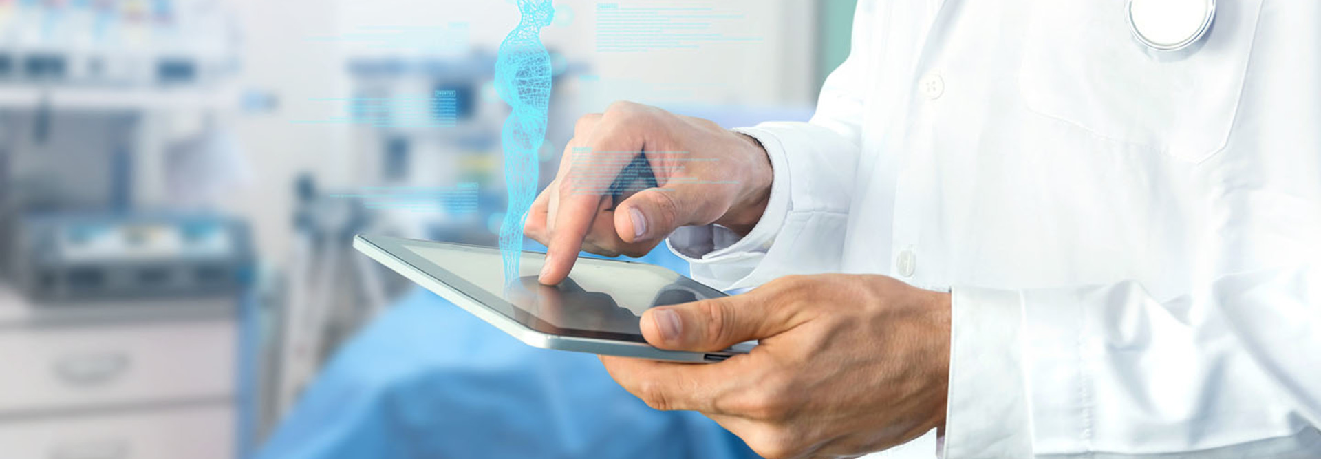 Doctor reviews data on tablet.