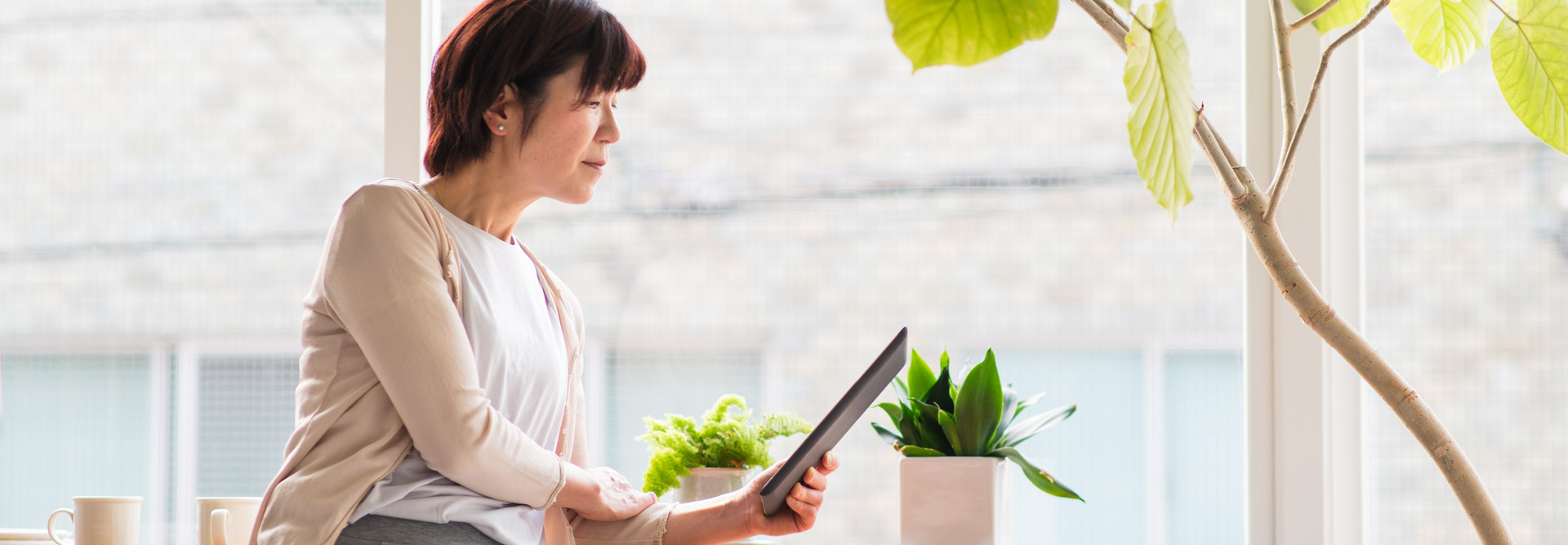 Senior in home with tablet