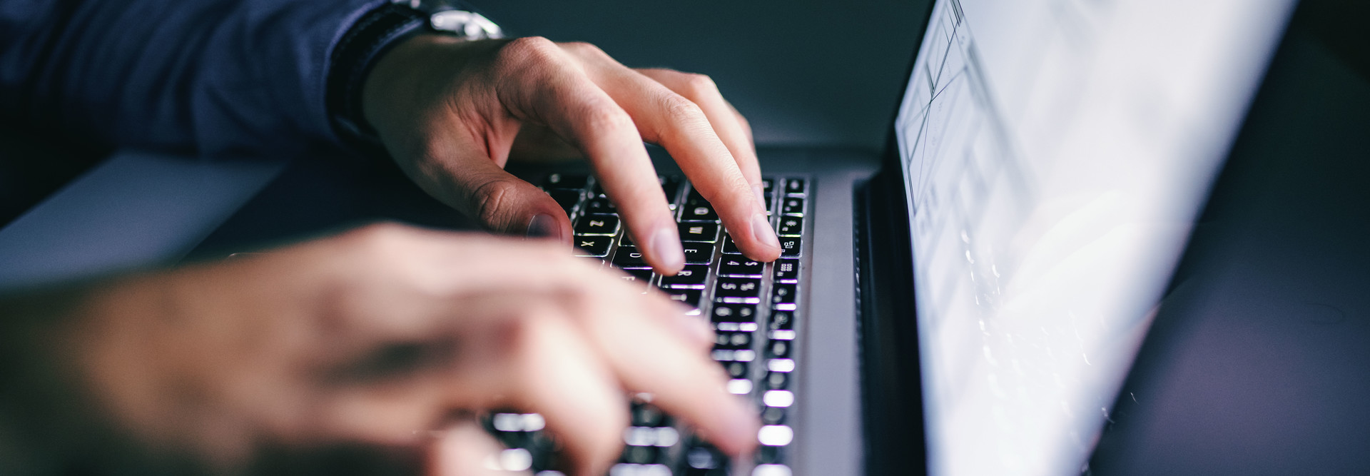 Man typing at night