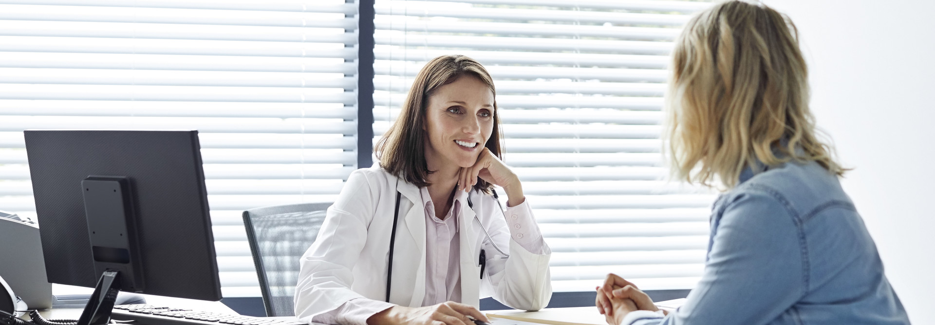 Doctor talks with patient