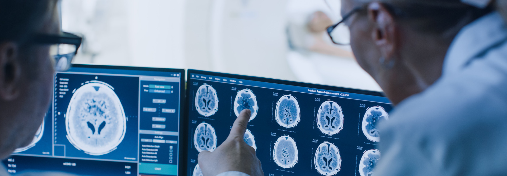 Clinicians looking at MRI scans