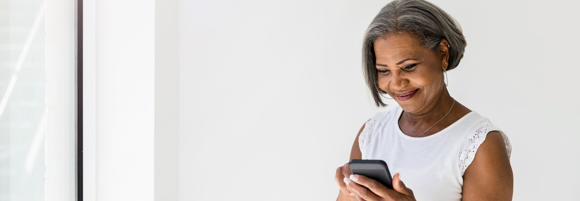 Senior uses smartphone