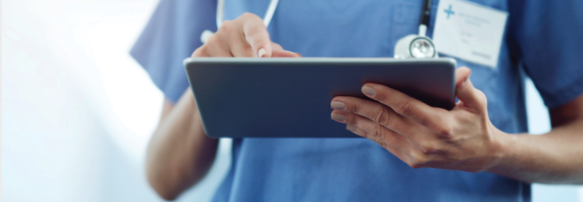 nurse using tablet in hospital