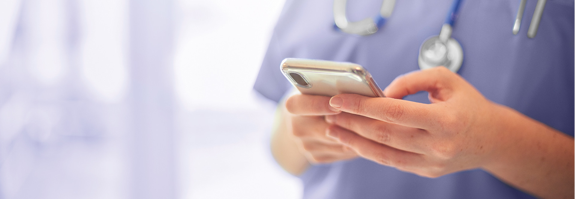 Close shot of nurse on smart phone.