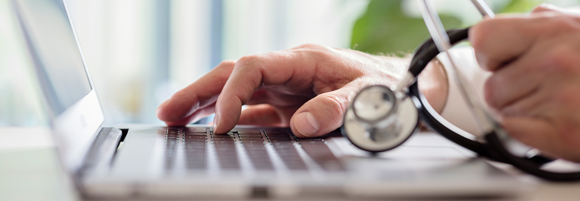 Doctor using laptop