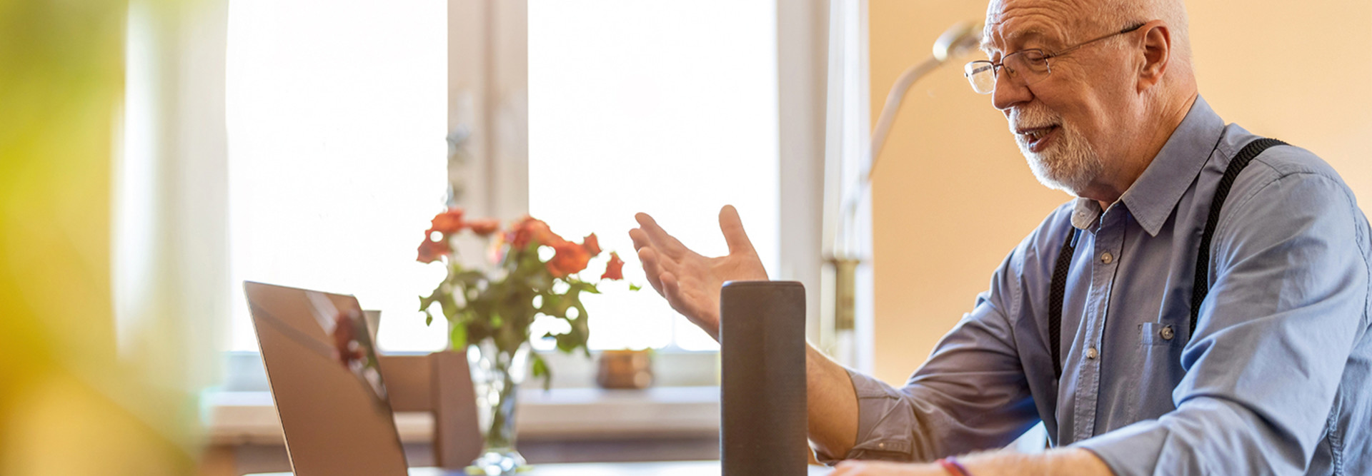 Older adult male using voice assistant technology