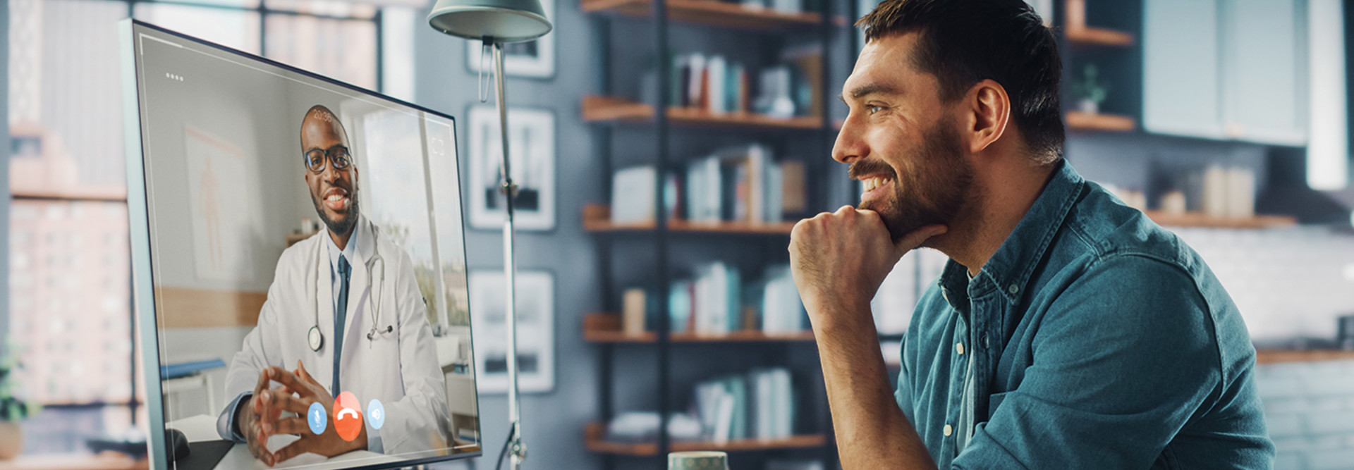 man attends telehealth visit with doctor