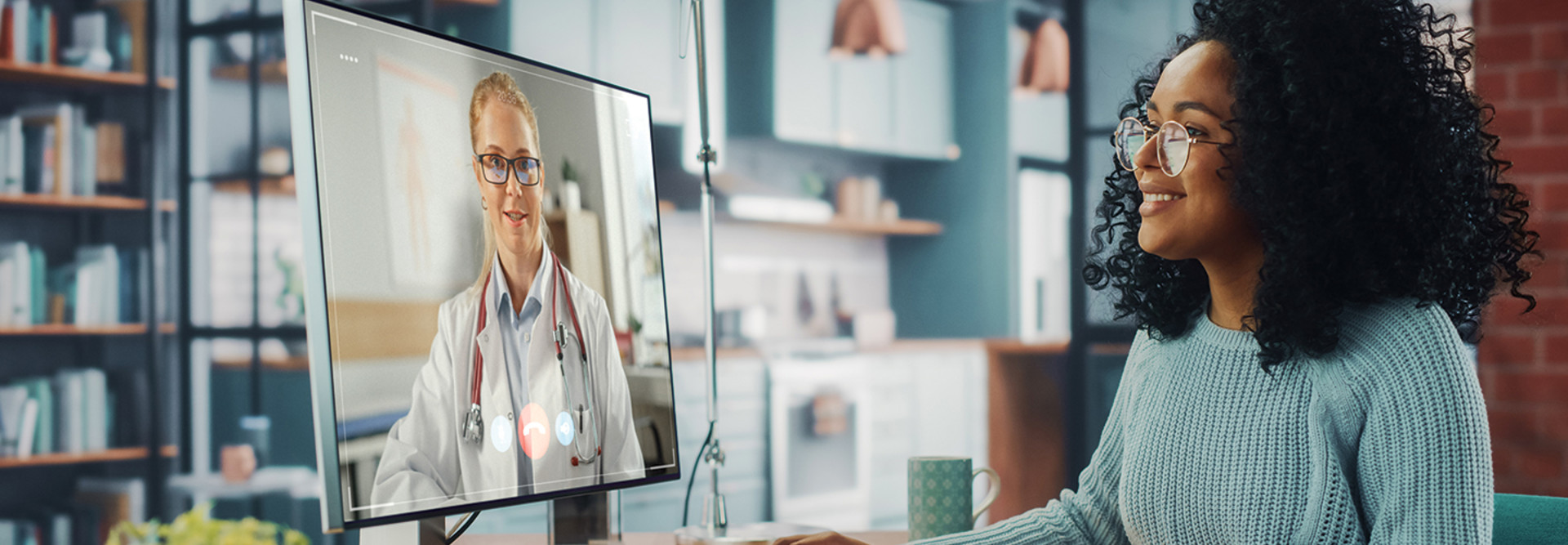 women attends telehealth appointment with doctor