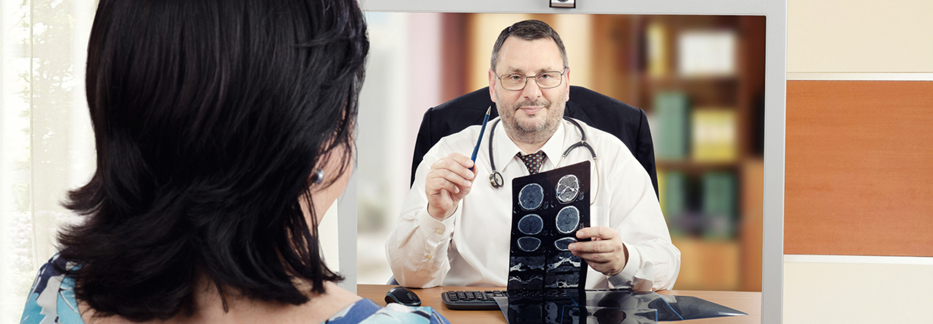 woman attends telehealth appointment with cardiologist