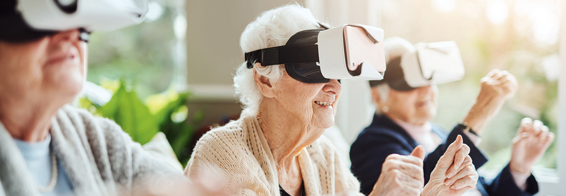seniors smile while using virtual reality 
