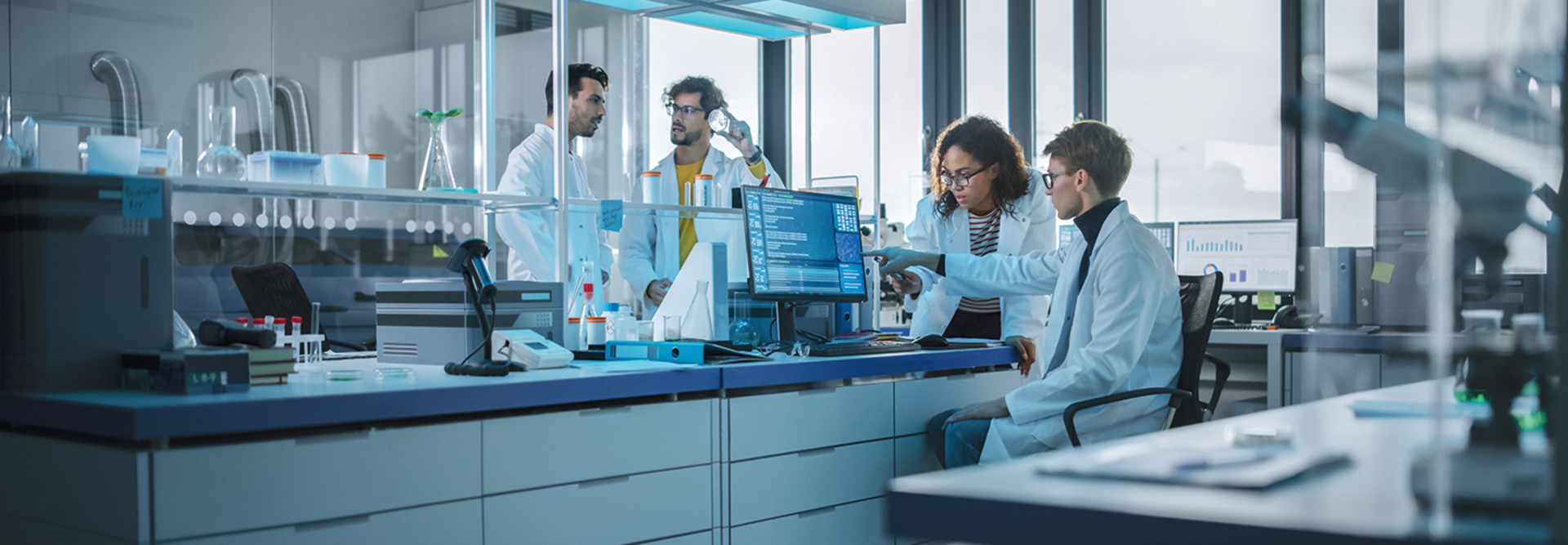 researchers evaluate clinical trial data in lab