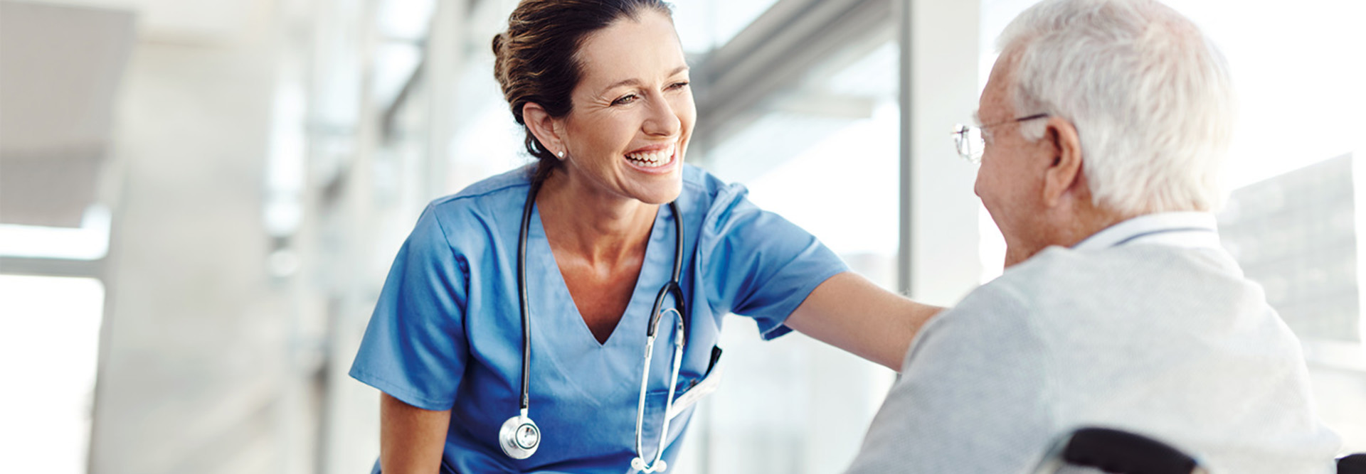 Post-acute nurse talks to patient