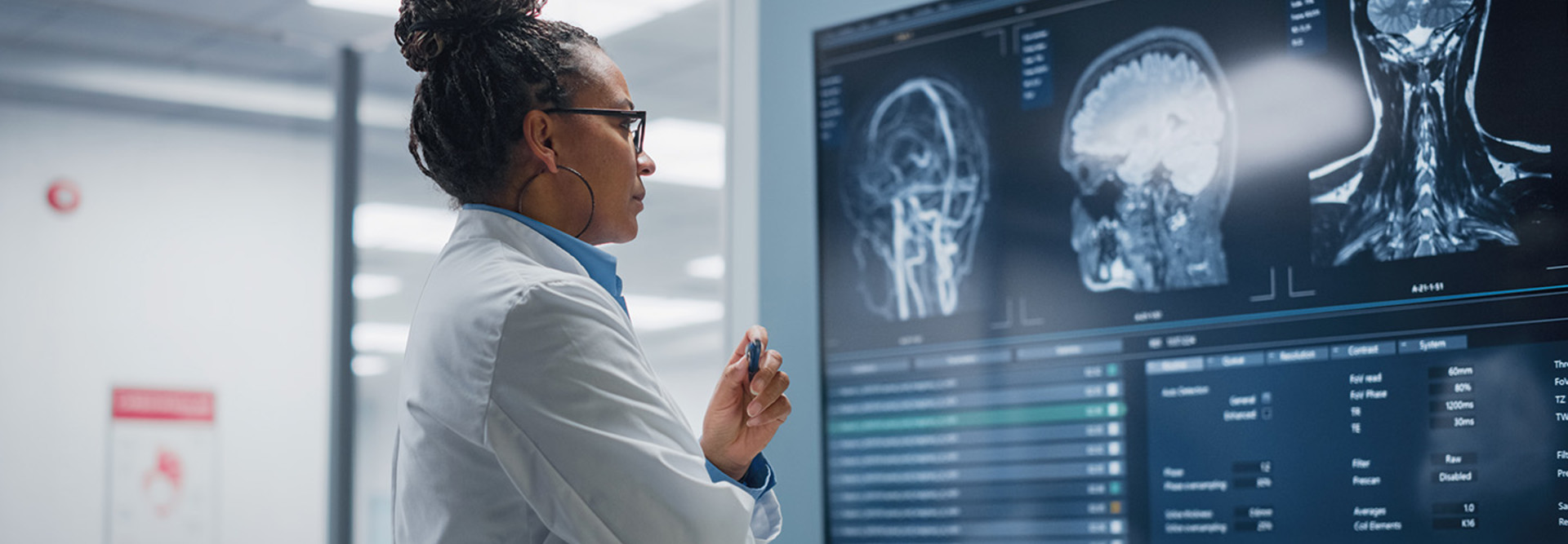 Doctor reviews a brain scan on a monitor