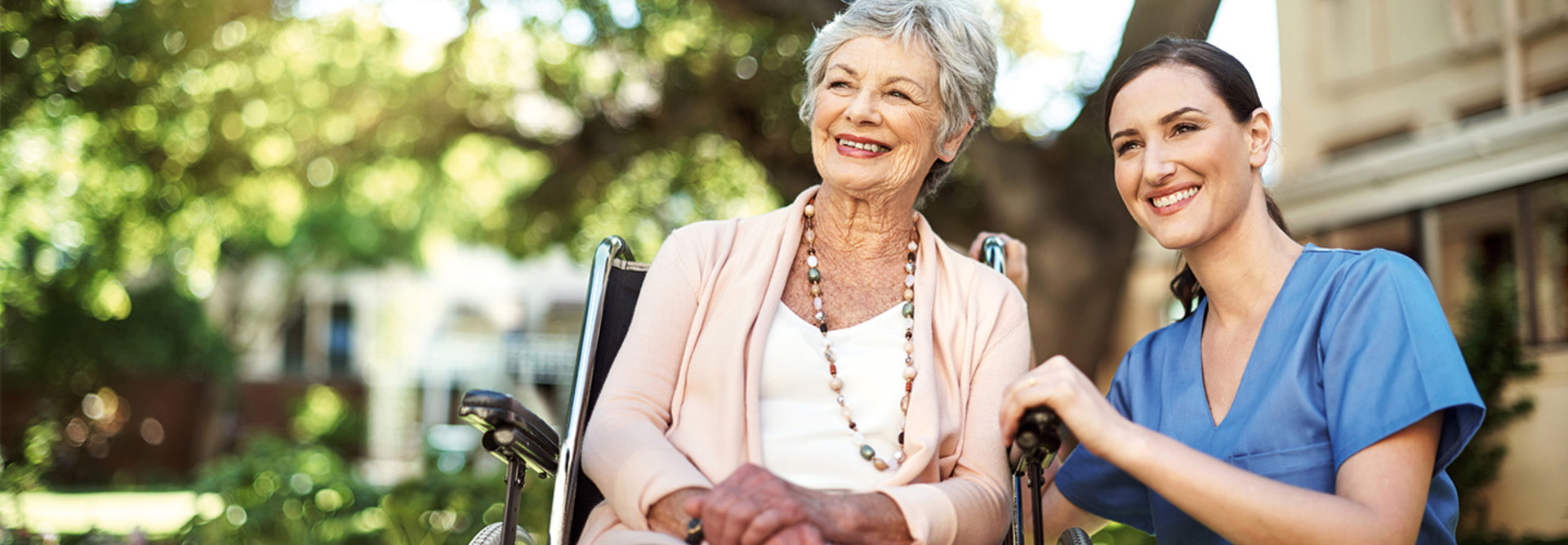 Nurse spends time with senior care resident