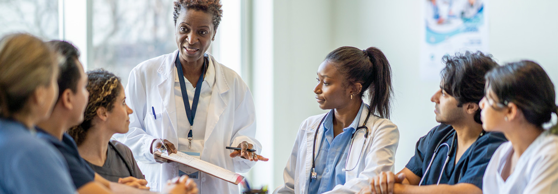 doctor meets with nurses