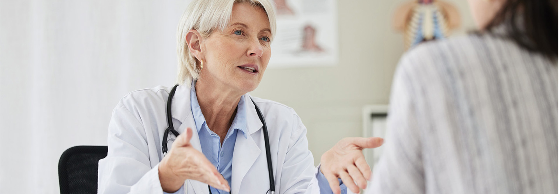 Doctor at concierge medicine clinic does a patient consult