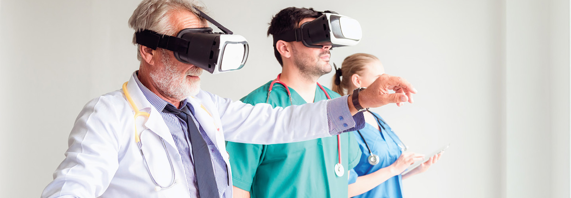 group of medical professionals train using VR headsets
