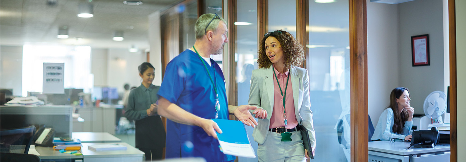 CXO walks with clinician in a hospital