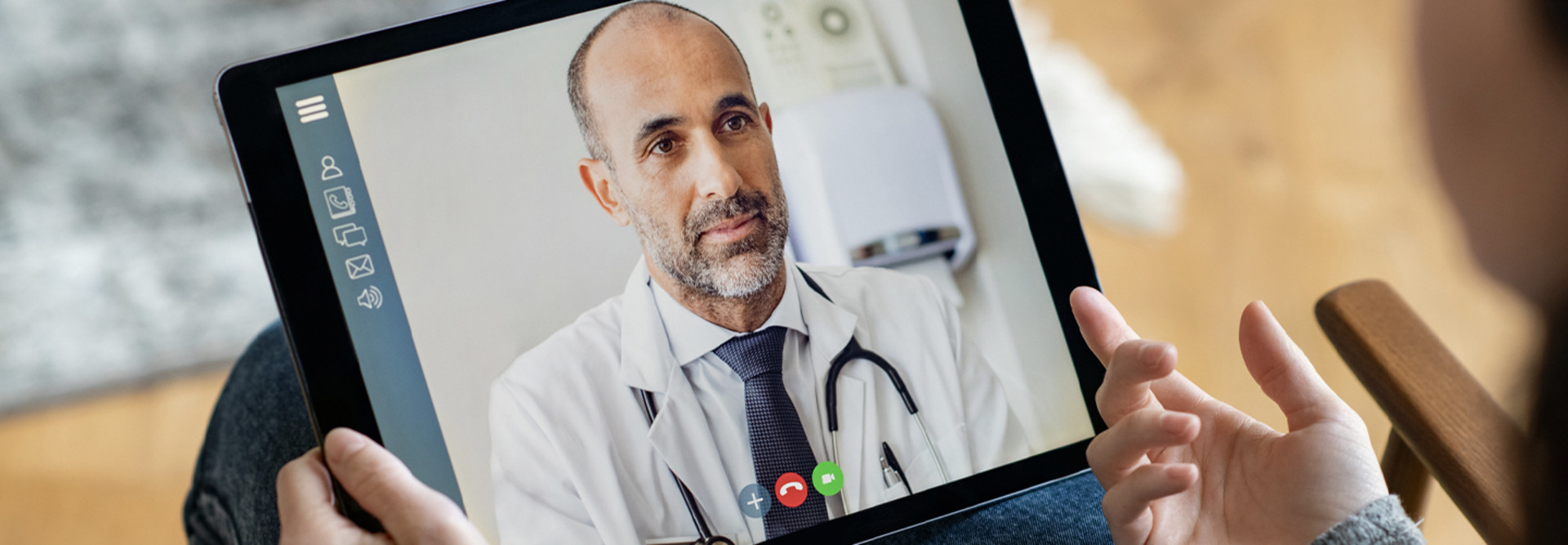 Doctor consulting with patient via telehealth