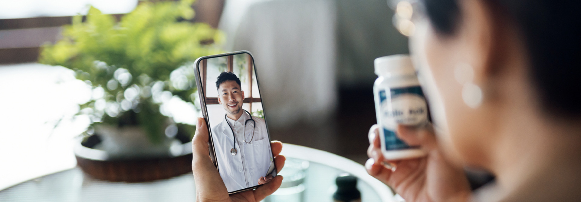 Elderly person speaking to doctor via telehealth