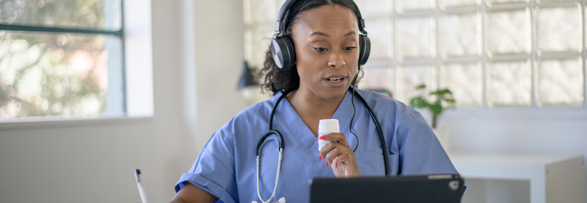 Nurse working with patient via telehealth