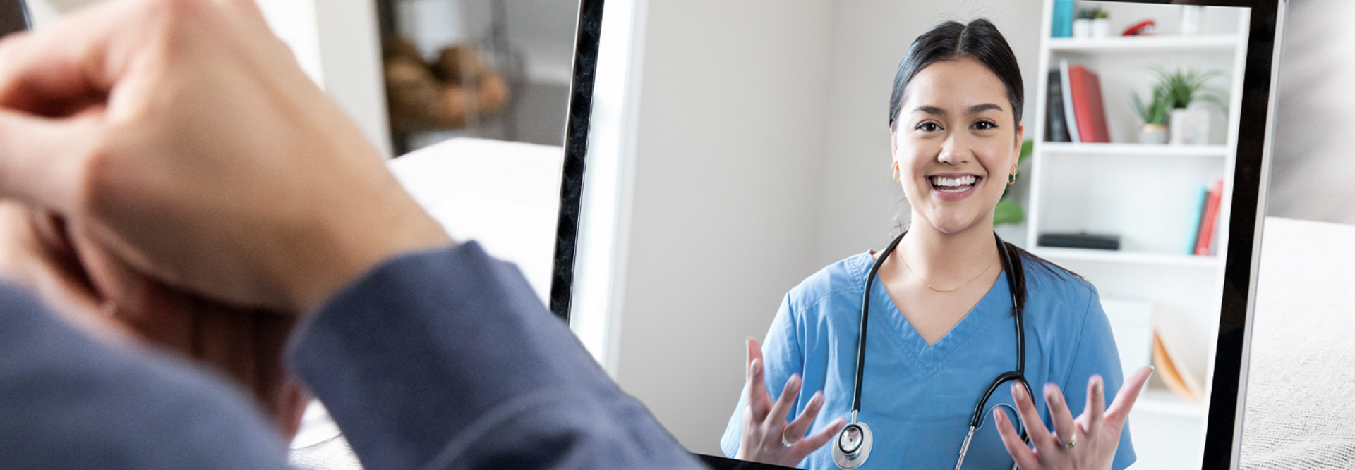Person speaking to doctor via telehealth