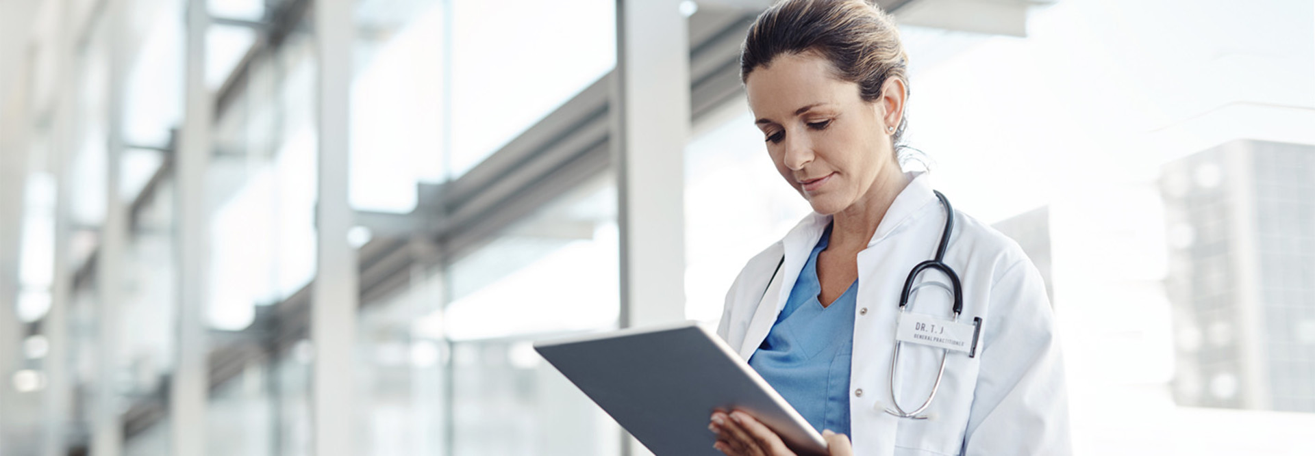 Doctor using a digital tablet