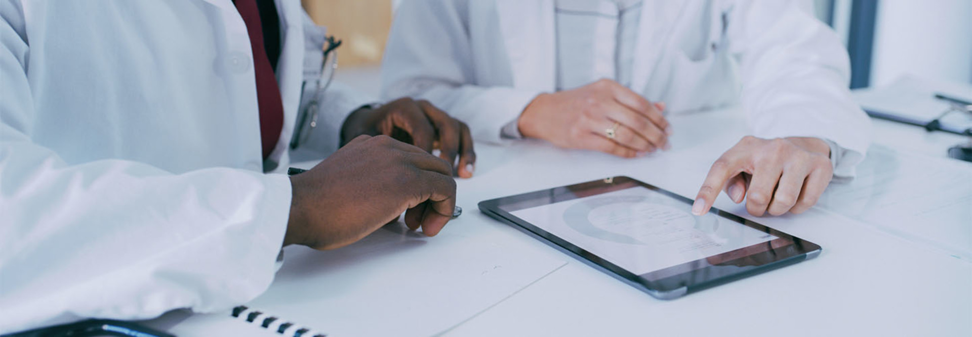 Two doctors discussing patient care