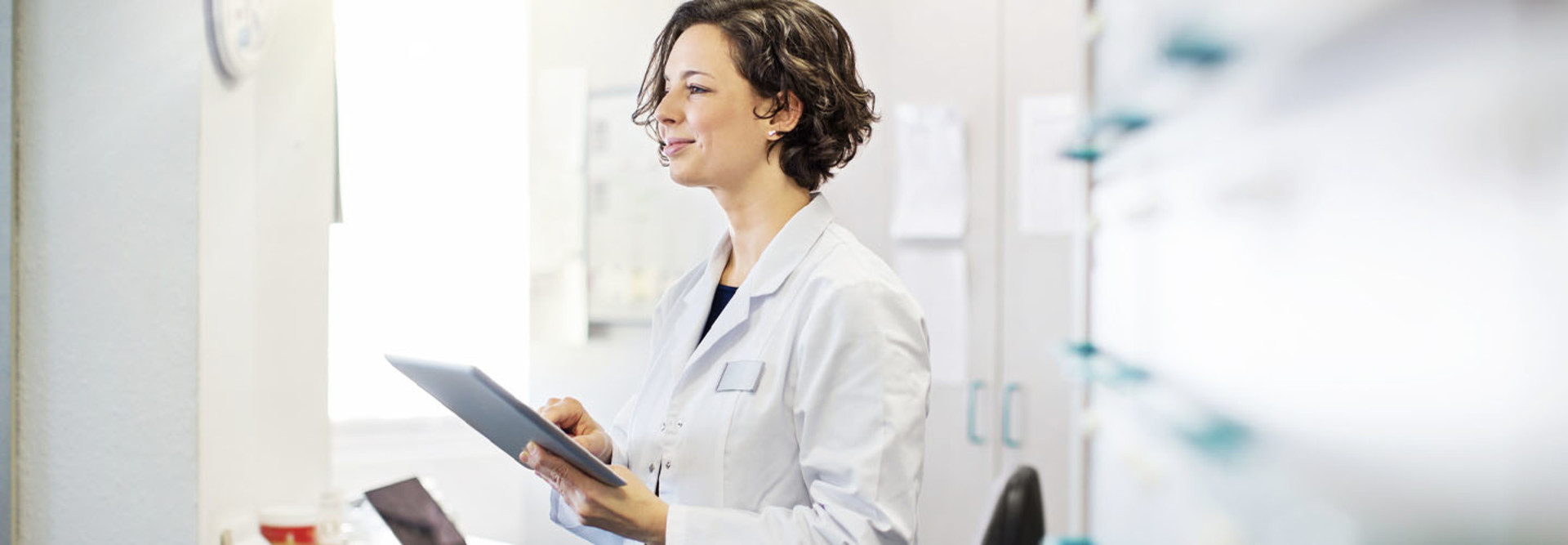 Doctor using tablet in office
