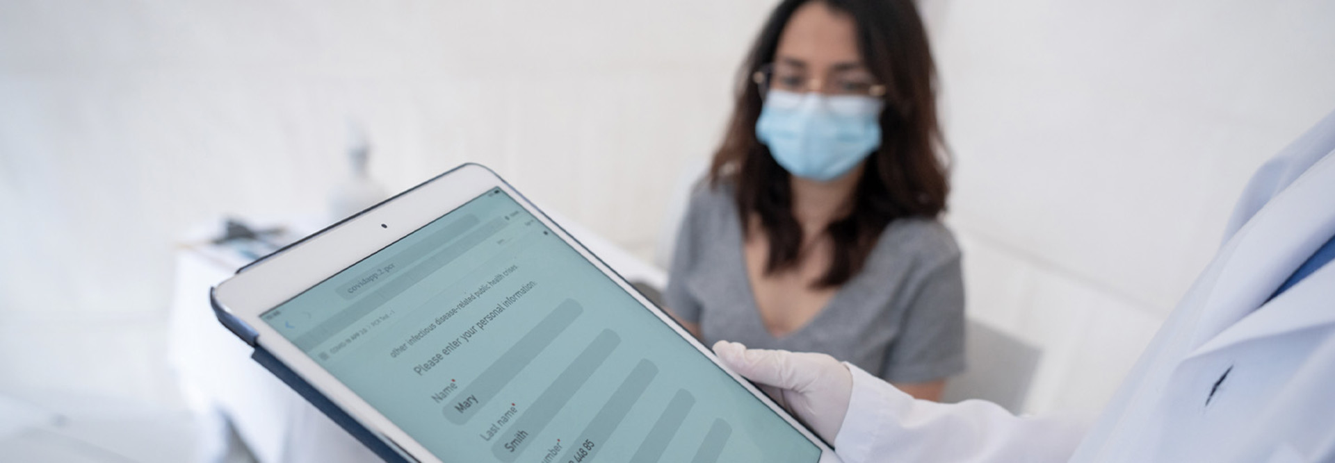 Doctor using tablet containing patient data