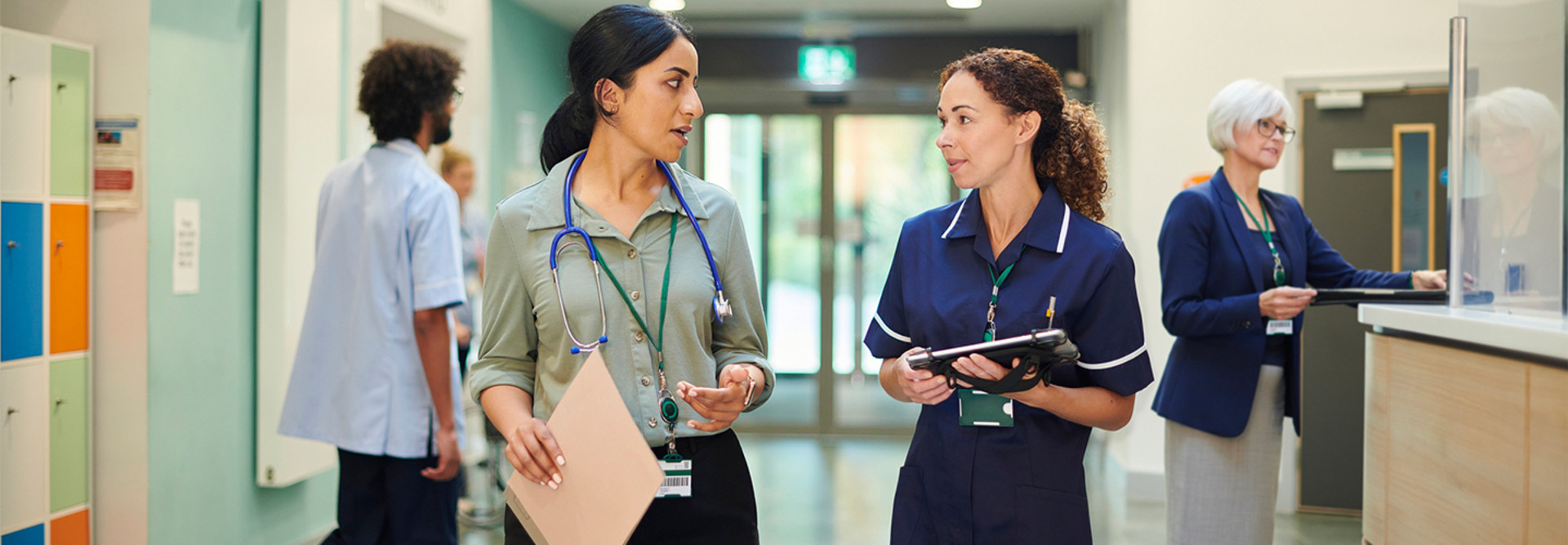 Doctor speaking with nurse in hospital