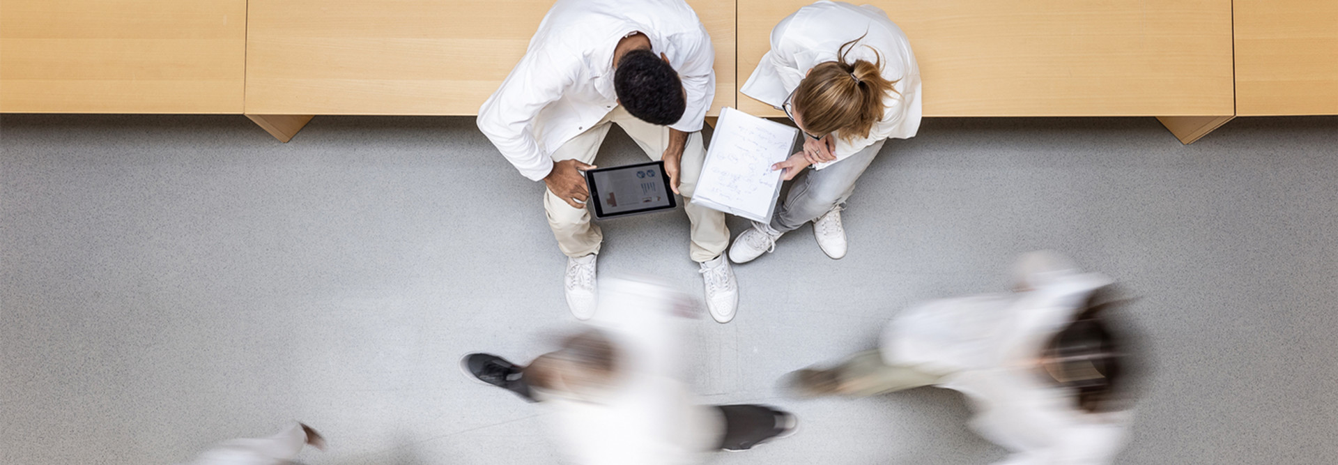 Doctors using devices in a hospital