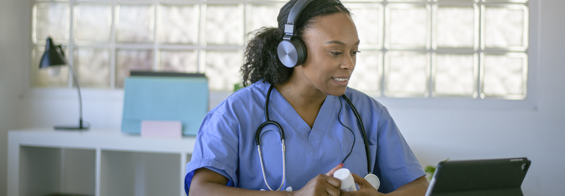 Female doctor working at her office doing telemedicine services