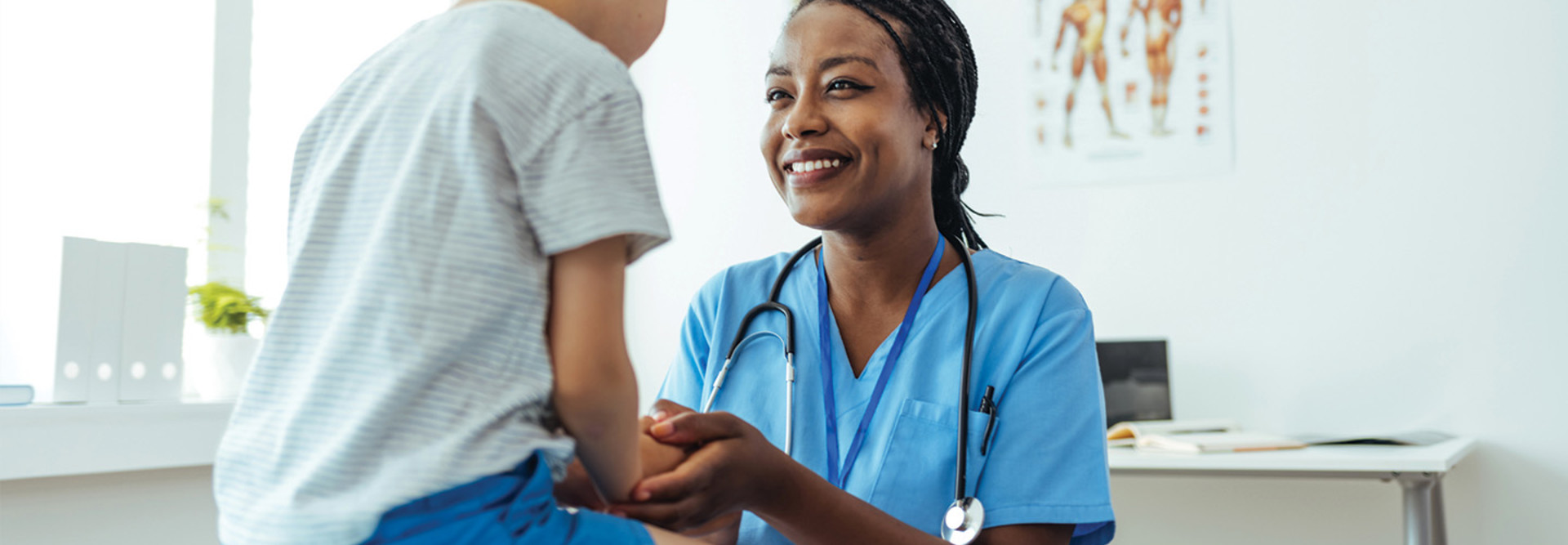 Doctor consoling young patient 