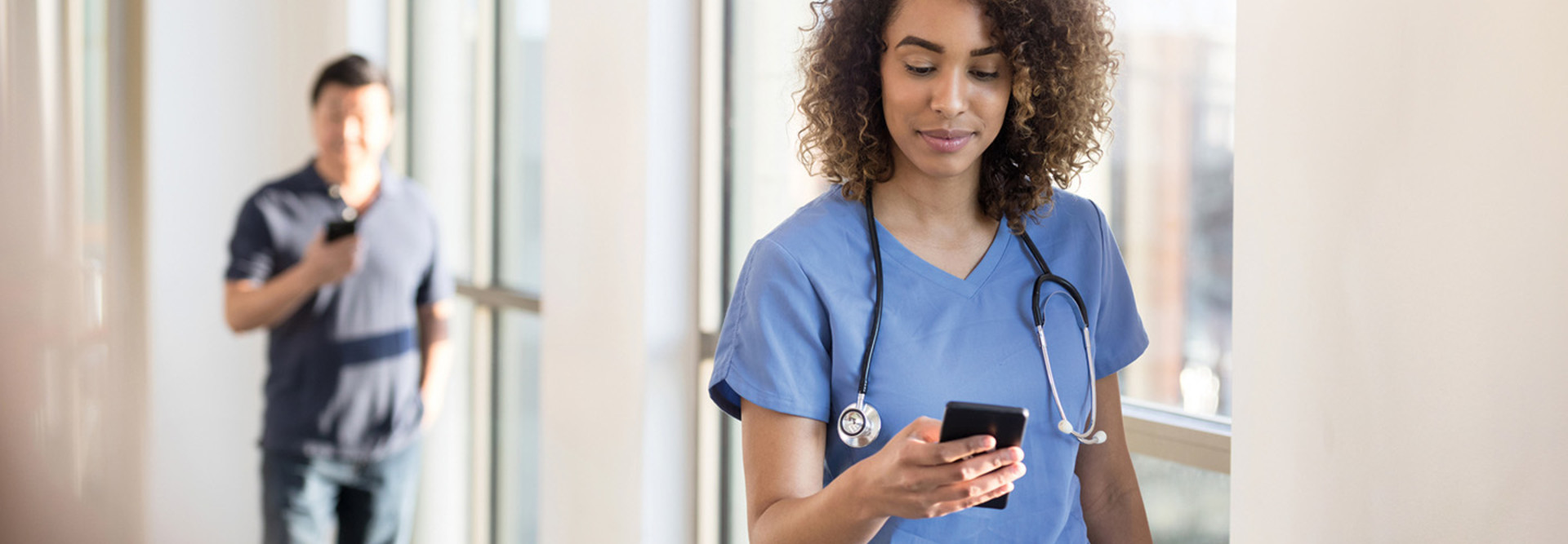 clinician on her smart phone