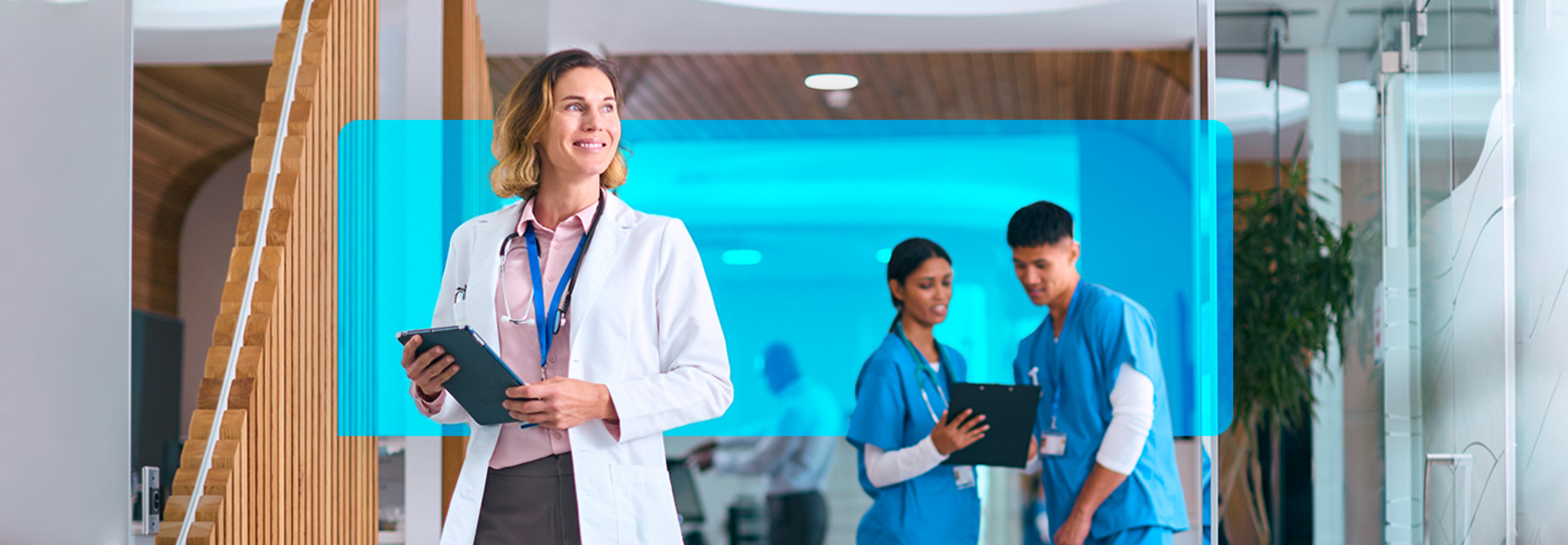 clinicians with devices in front of texting iconography