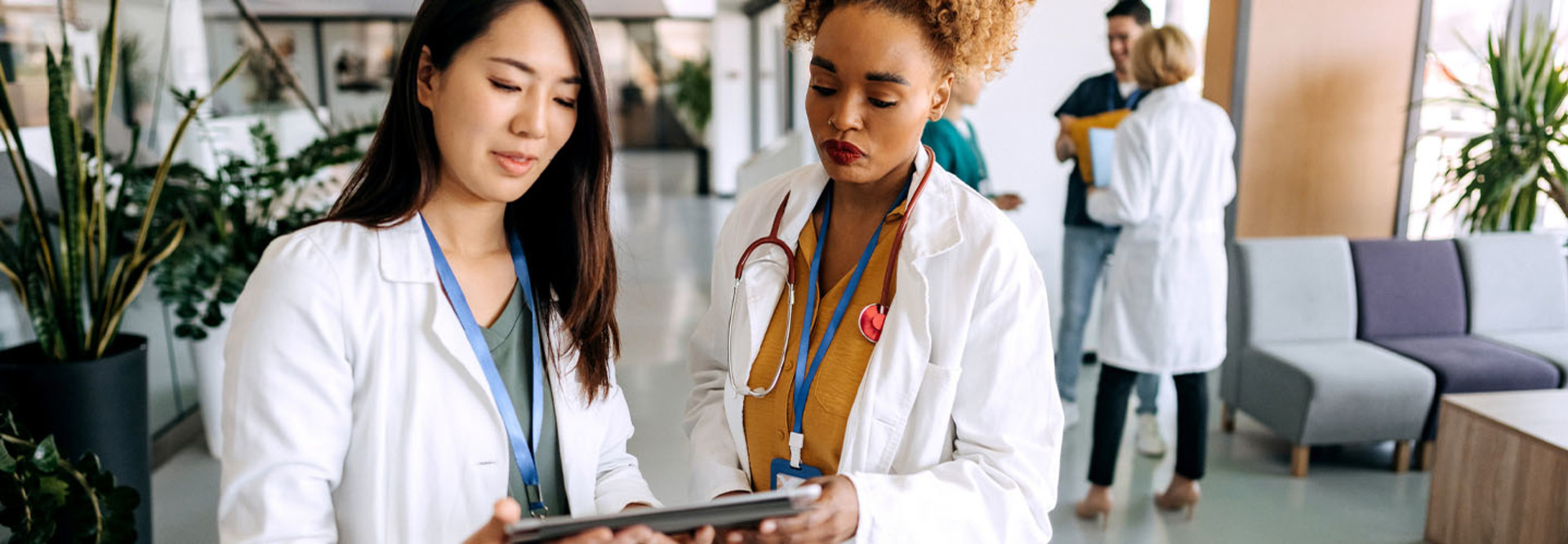 Doctors talking in hospital corridor