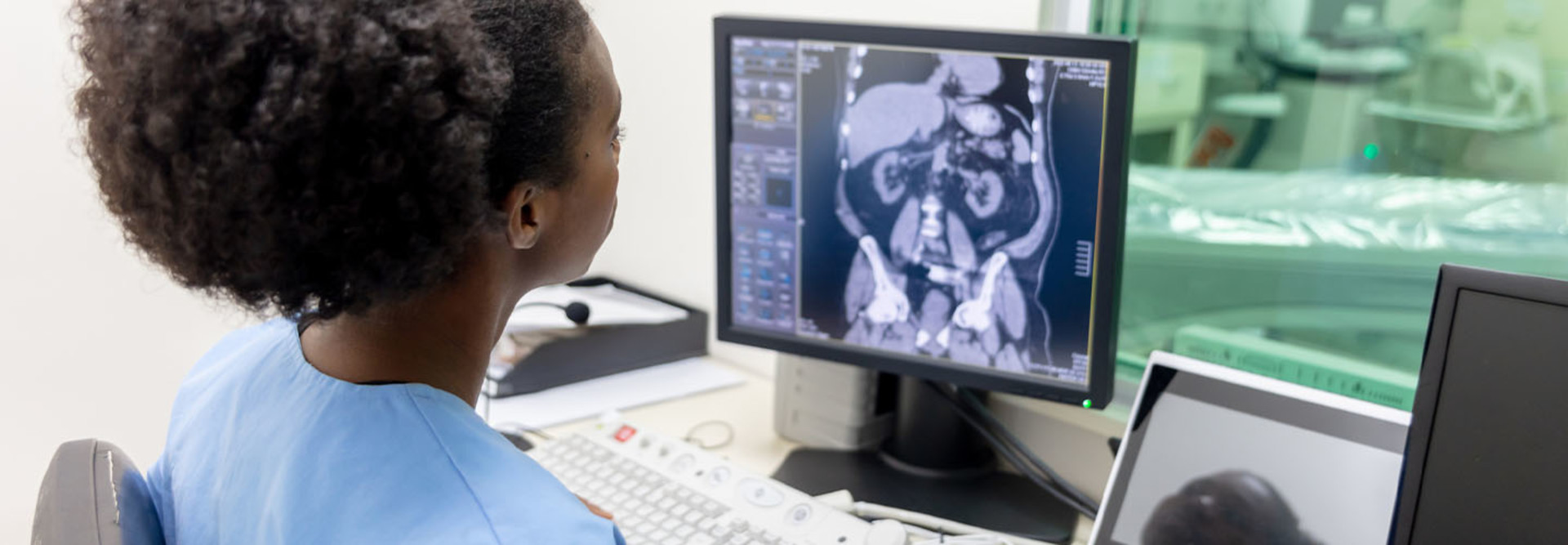 Nurse reviewing CAT scan