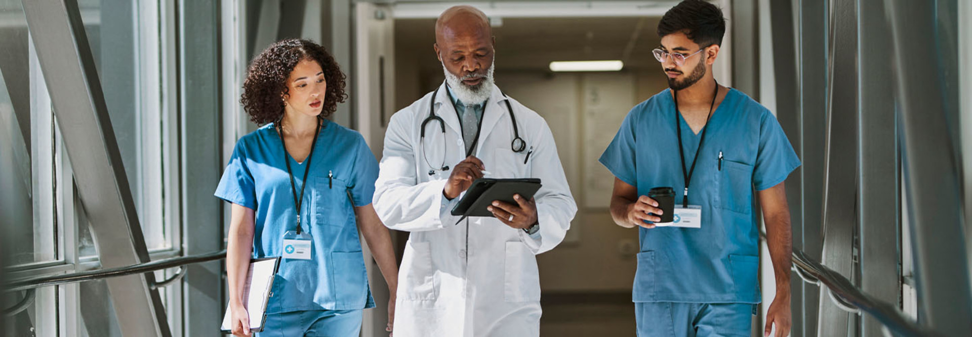 Doctor and nurses using technology in hospital