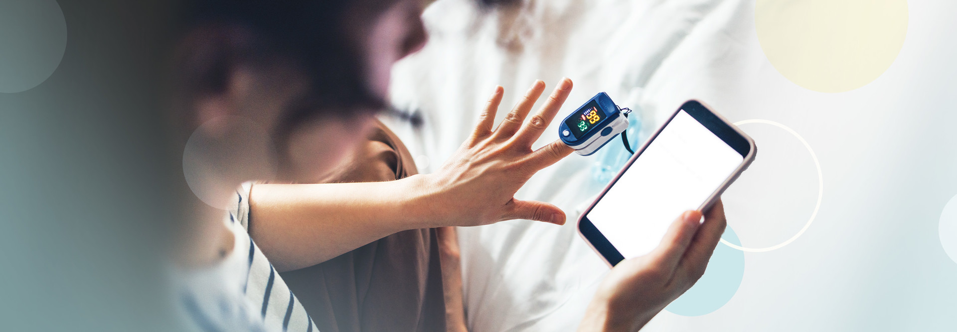 Person using mobile device to take their pulse